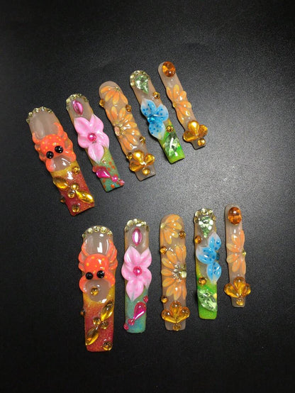Tropical flower and amber gem extra long coffin press-on nails flat lay