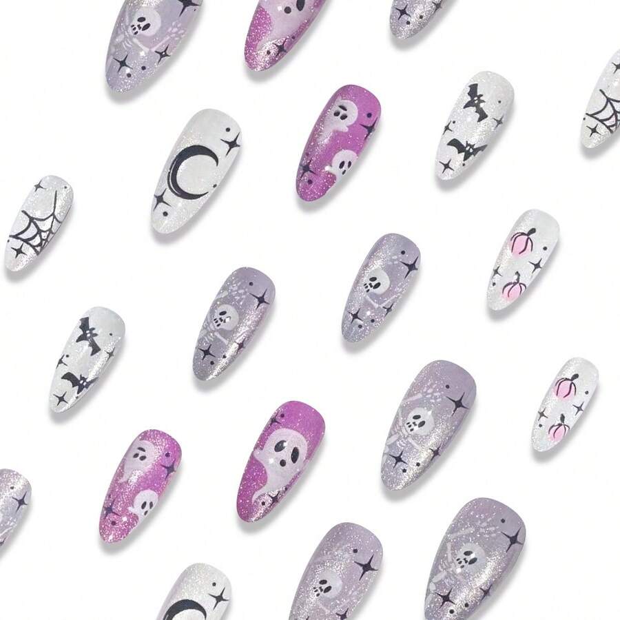 Haunting Hour press-on nails laid out, crescent moon skull and spiderweb designs