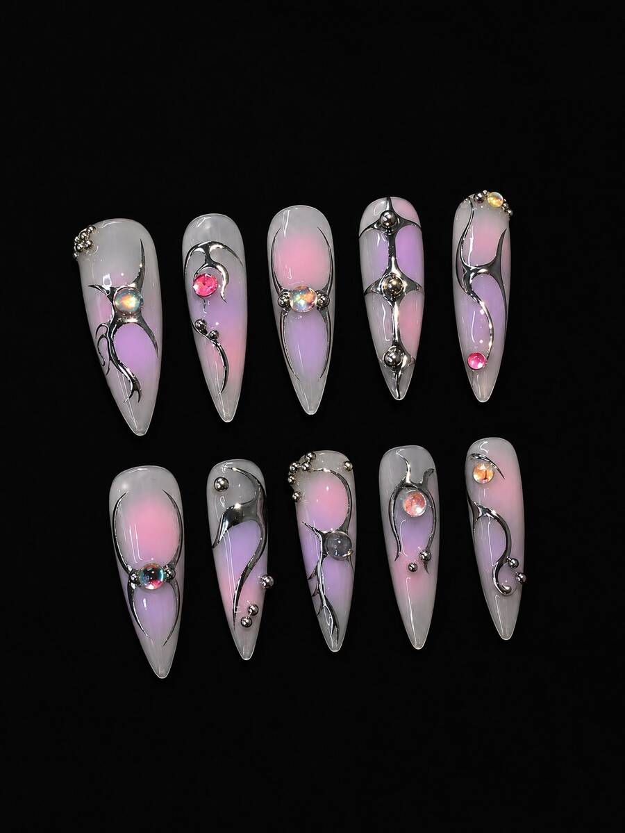 Close view of pink aura nails with hand-set crystals