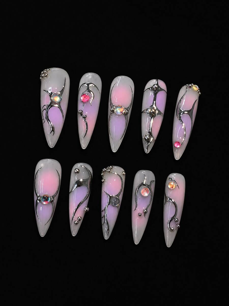 Full set of ten long almond press-on nails laid flat