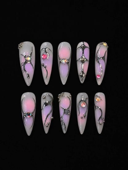 Long almond press-on nails in pink aura with silver vine linework