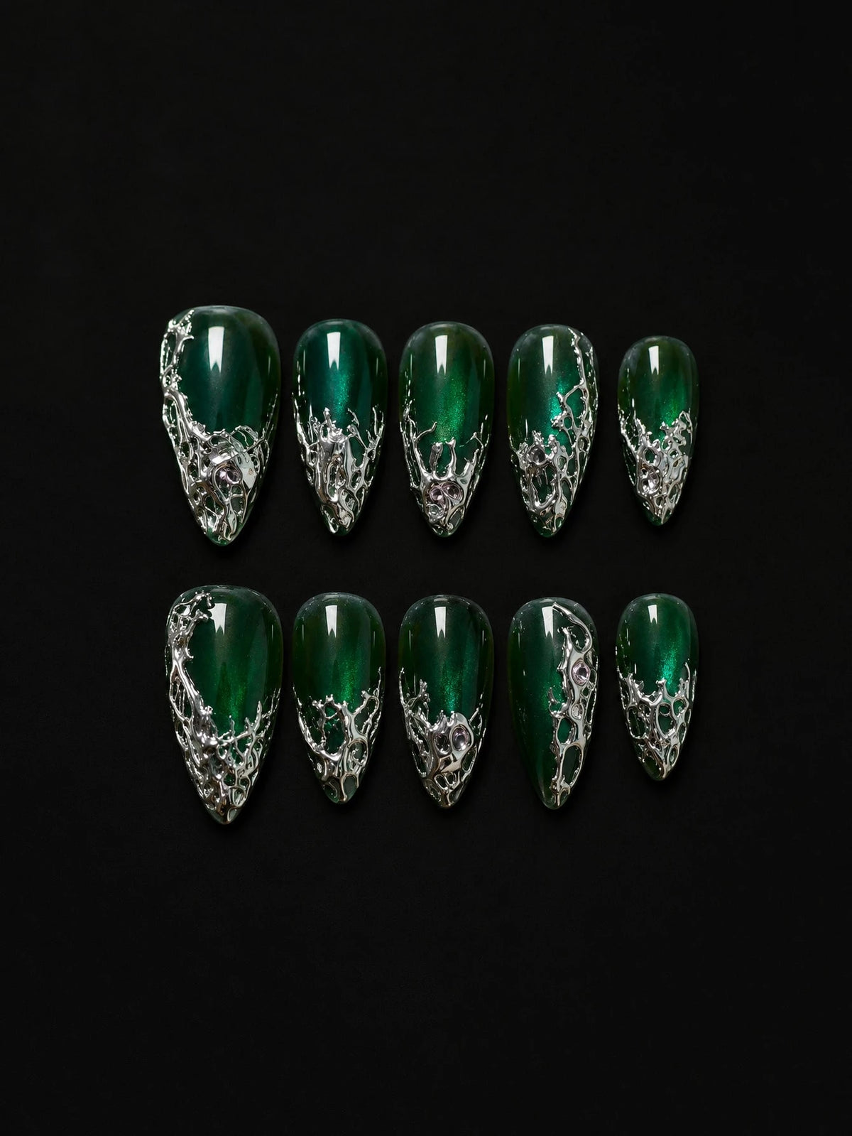 Emerald cat-eye almond press-on nails with liquid silver chrome on black