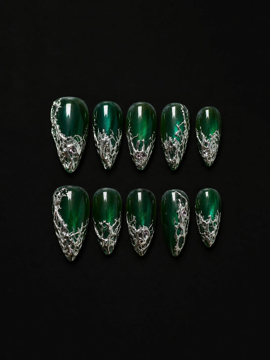 Emerald cat-eye almond press-on nails with liquid silver chrome on black