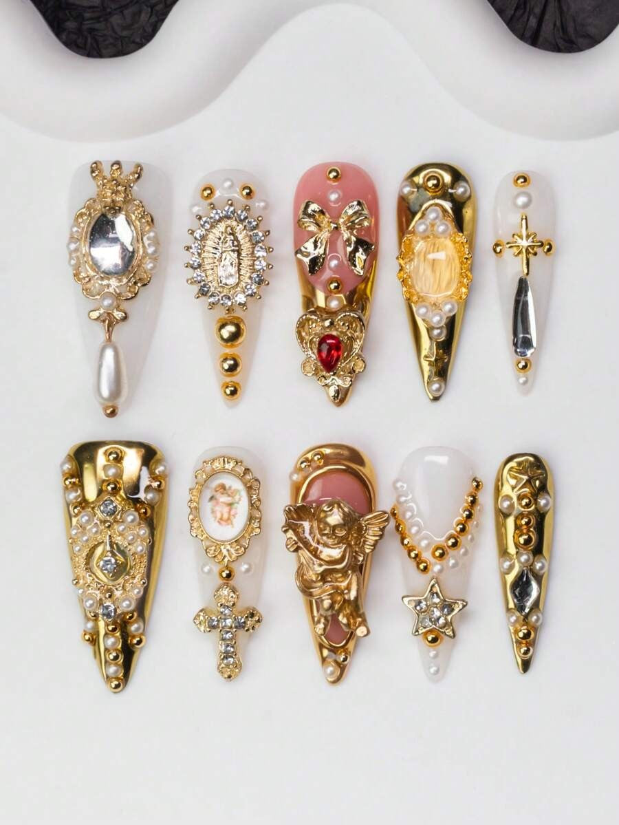 White and pink baroque stiletto press-on nails with pearls and gold crosses