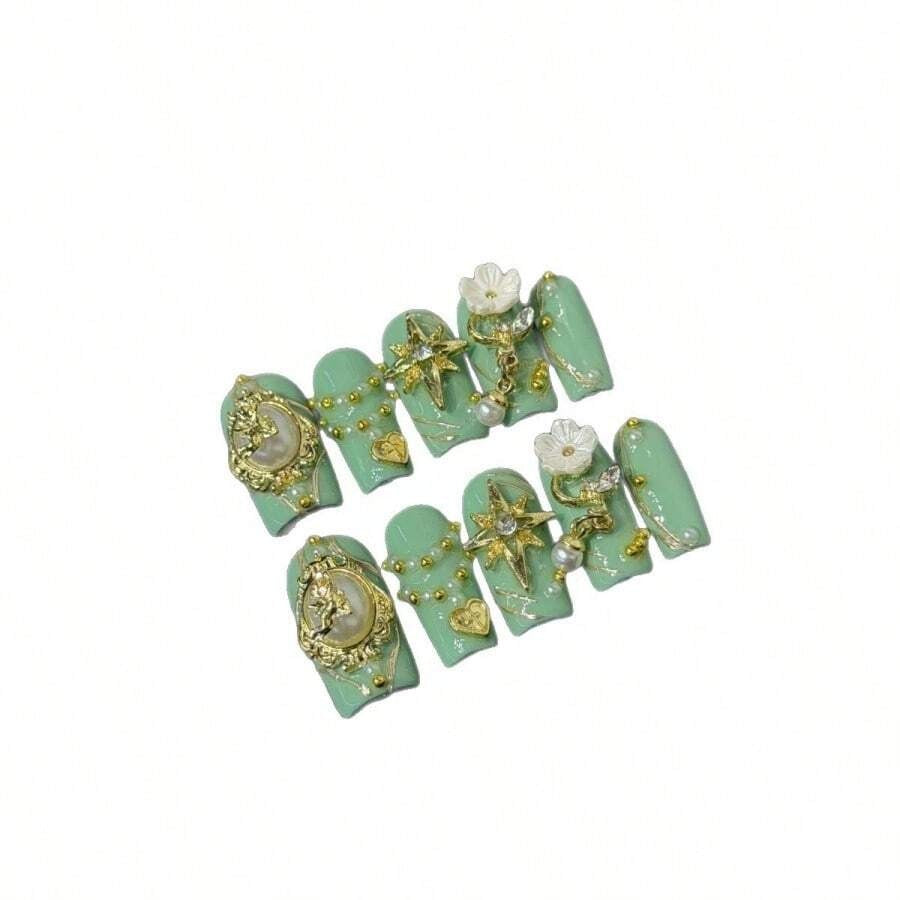 Sage Cameo press-on nails on hand