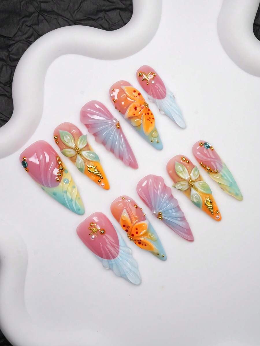 Coral Cove press-on nails seashell and lily detail