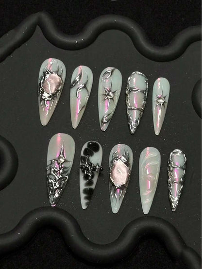 Frosty mint stiletto press-on nails with pink cat-eye stone and silver filigree