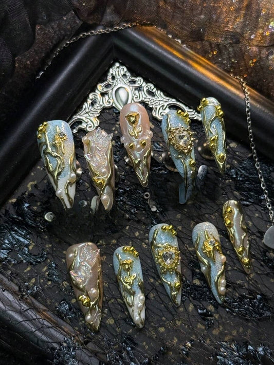 Gilded Tide pale blue and gold rose cat-eye long stiletto press-on nails