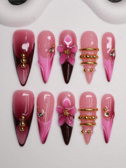 Burgundy-to-pink ombre French long stiletto press-on nails with 3D flower and gold rings