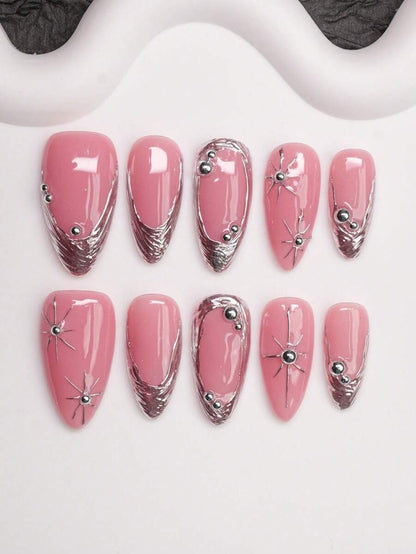 Pink almond press-on nails with chrome silver French tips and silver star charms