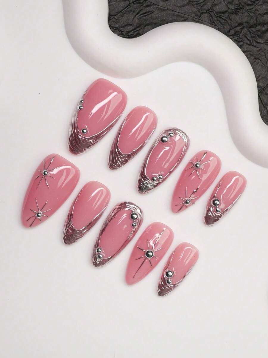 Pink chrome French almond press-on nails with silver stars