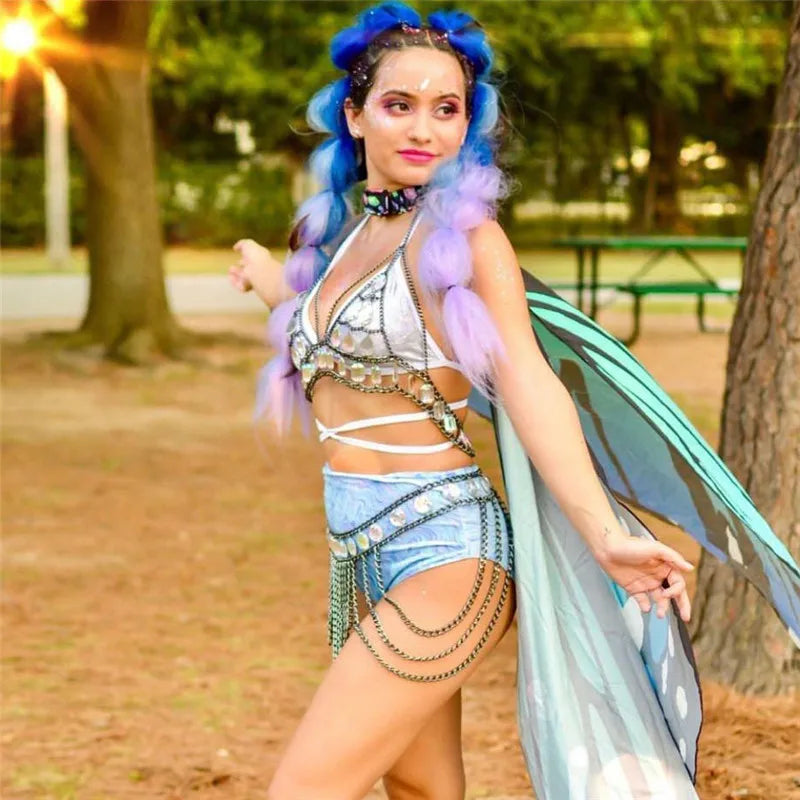 Iridescent rhinestone chain bra and skirt set worn at a festival