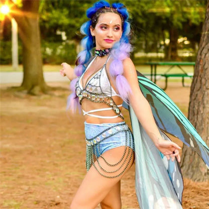 Iridescent rhinestone chain bra and skirt set worn at a festival