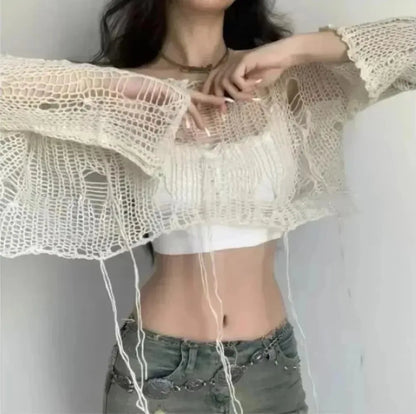 Cream distressed knit crop sweater sleeve detail