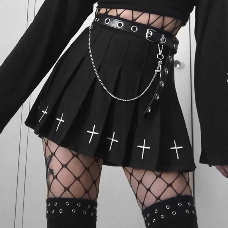 Black pleated mini skirt with embroidered crosses, front view