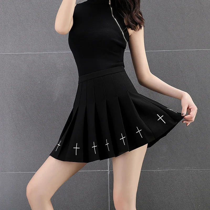 Black cross print pleated mini skirt in motion