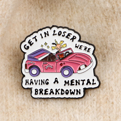 Enamel pin styled on knit fabric