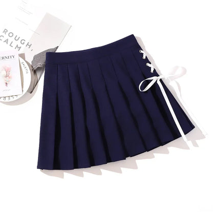 Navy pleated mini skirt with white side ribbon lacing