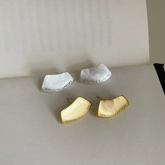Brushed silver and gold sculptural stud earrings