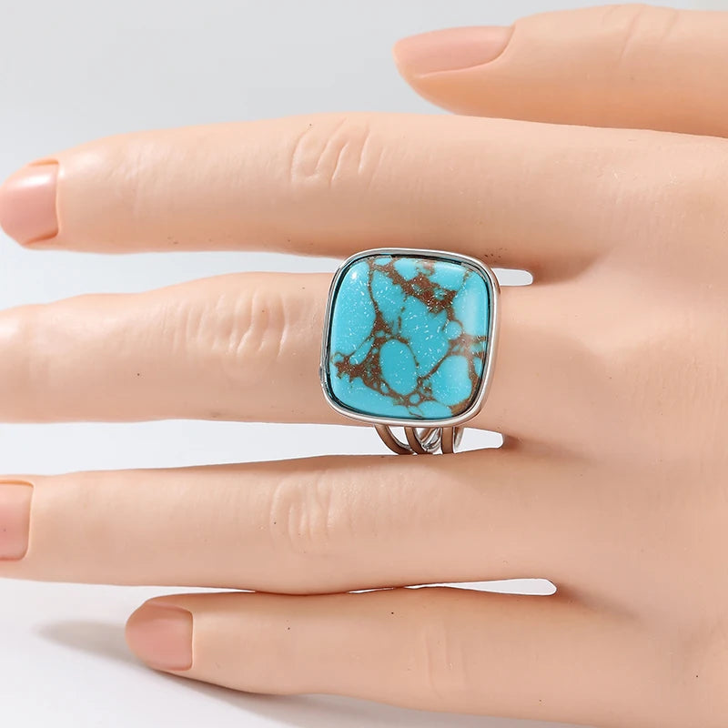 Statement ring shown on a hand for scale