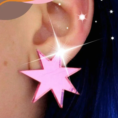 Hot pink mirror star stud worn on the ear