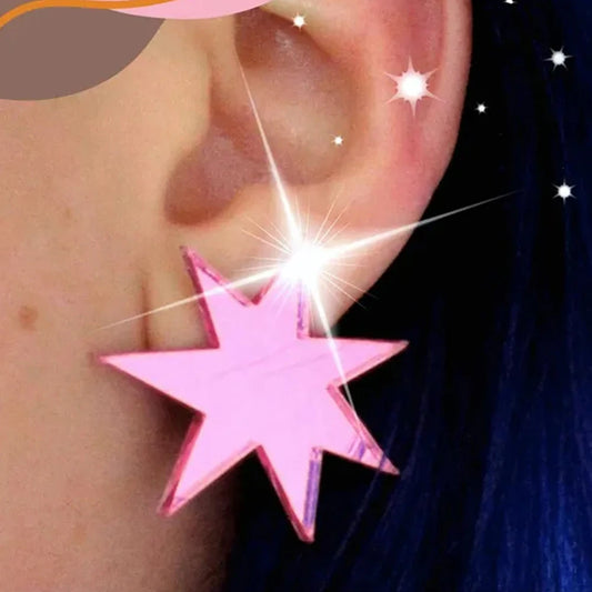 Hot pink mirror star stud worn on the ear