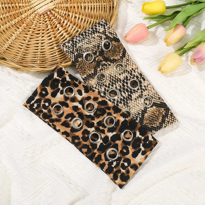 Leopard and snake print eyelet headbands laid flat