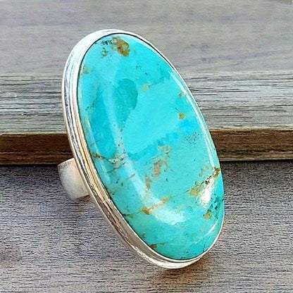 Sky Vein faux turquoise oval cocktail ring on a silver-tone band