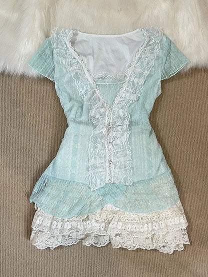 Mint lace top with ruffled placket and pearl-look buttons