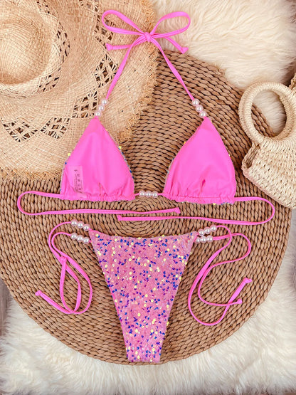 Pink sequin bikini set flat lay