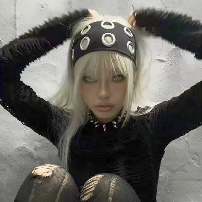 Model wearing black grommet stretch headband low across the brow