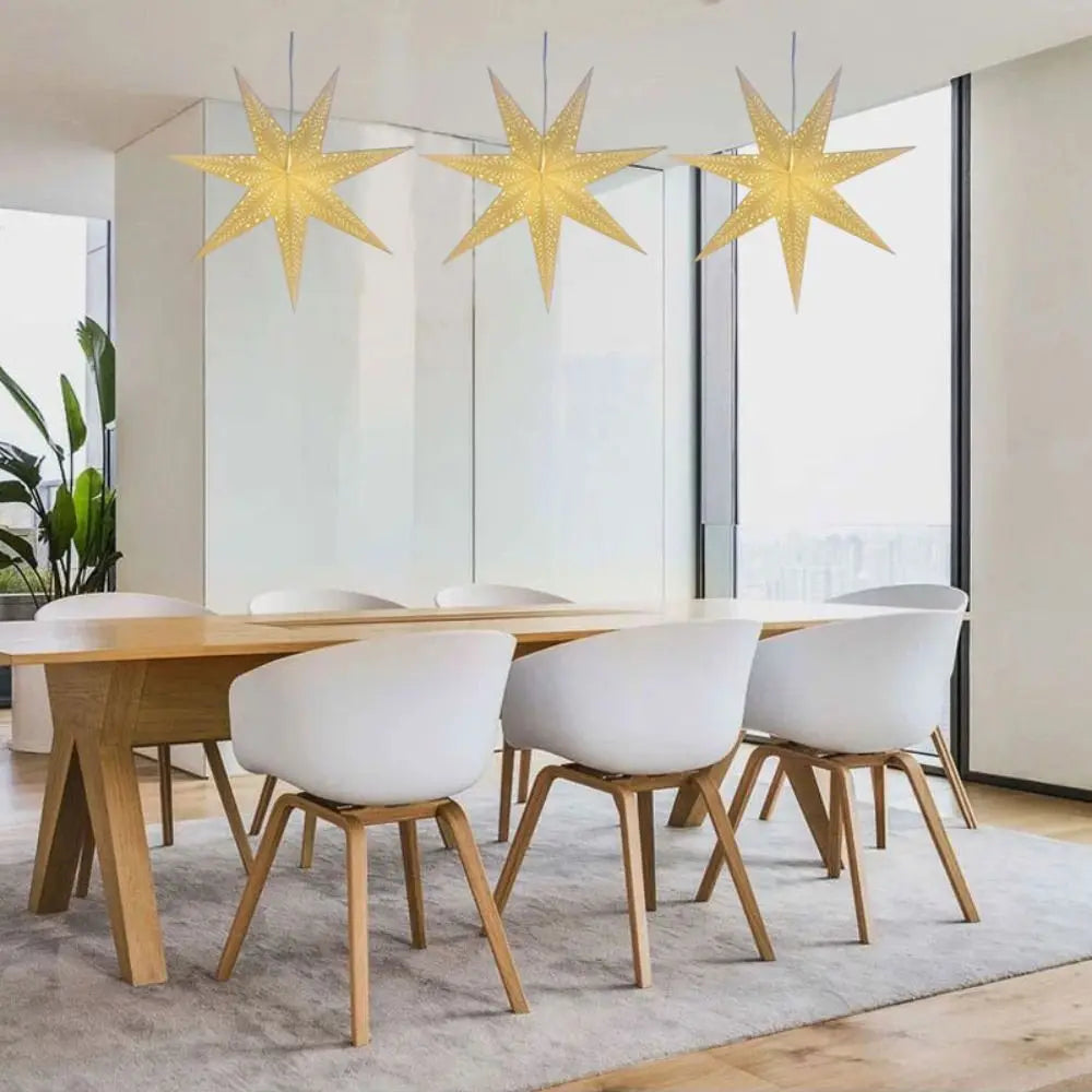 Three paper star lanterns hung at staggered heights