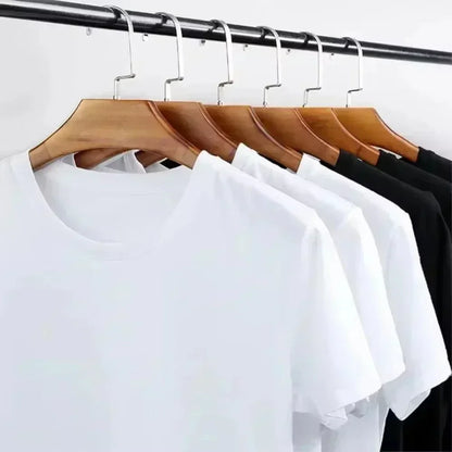 Black and white tees hanging on a rail