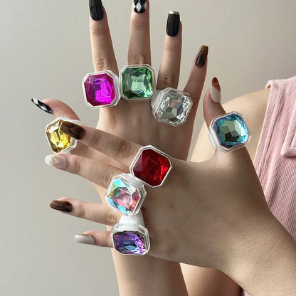 Multiple cocktail rings worn together