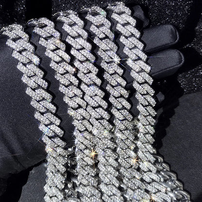 Chrome-silver iced Cuban link chains held up close