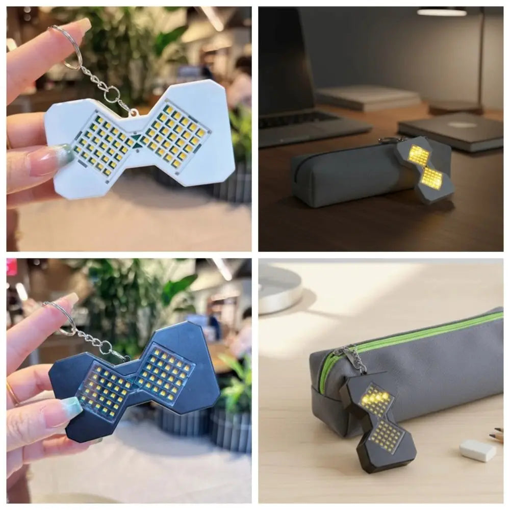 LED hourglass keychain clipped to a bag and sitting on a desk
