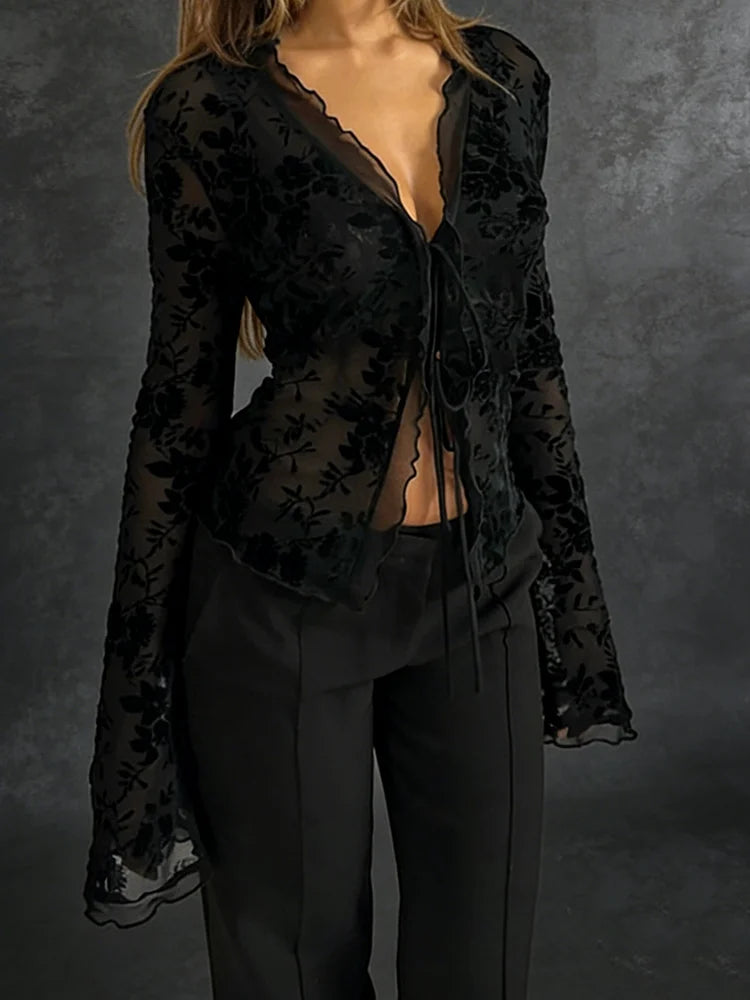 Sheer black mesh top with velvet-flocked roses, plunging self-tie front and long bell sleeves