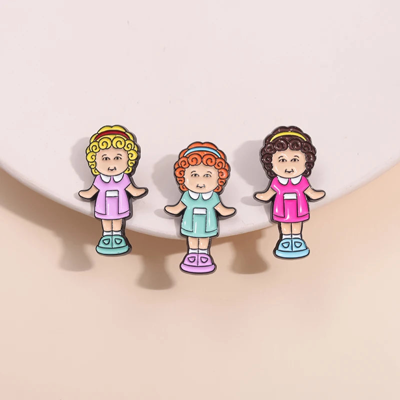 Three doll pin designs