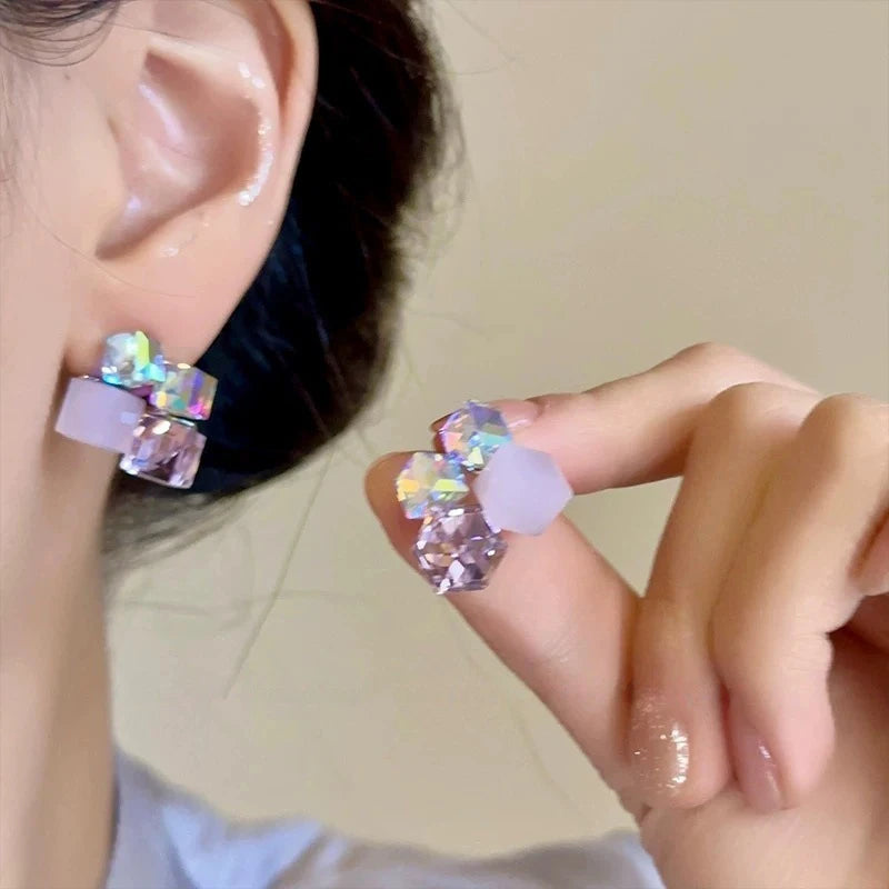 Pink crystal cube cluster studs on the ear