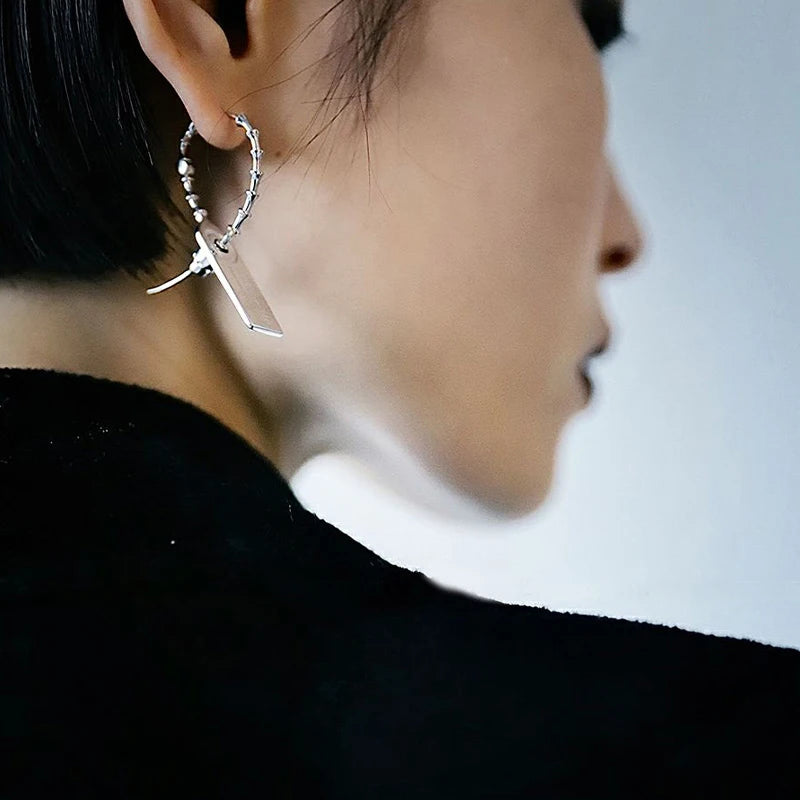 Buzzsaw cyber drop earring profile view