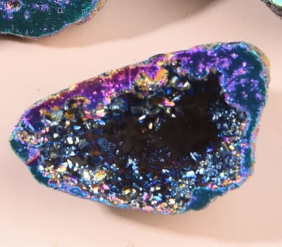 Purple and teal aura agate geode