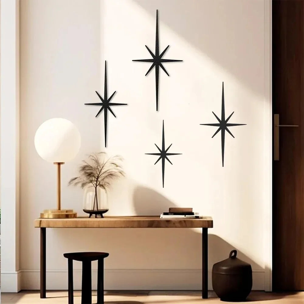 Matte black atomic starburst metal wall set above a console table