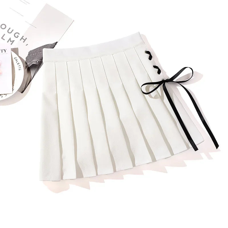 White pleated mini skirt with black side ribbon lacing