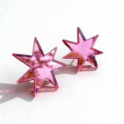 Pair of pink mirror acrylic star studs on white