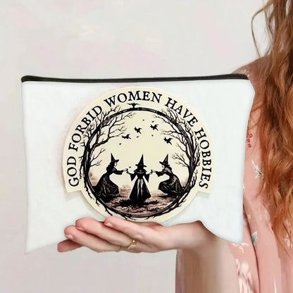 Witch print makeup pouch reading God Forbid Women Have Hobbies, front view