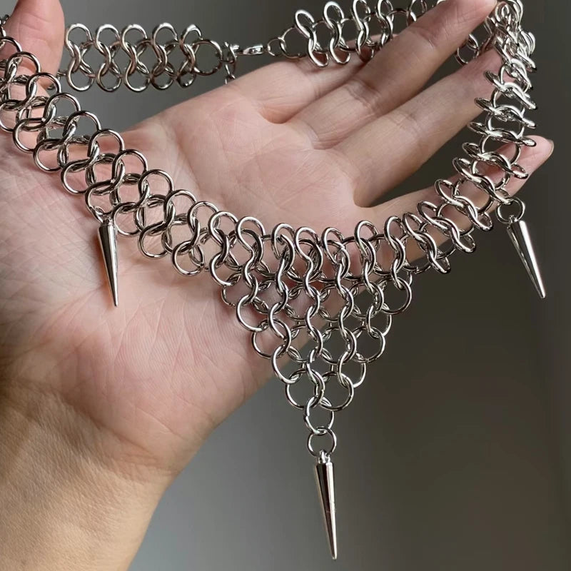 Chainmail spike collar held in hand