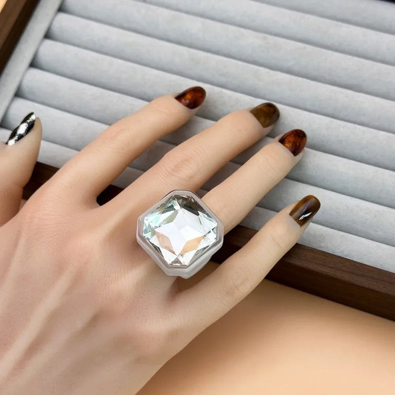 Clear faceted cocktail ring worn