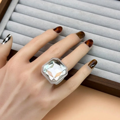 Clear faceted cocktail ring worn