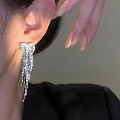 Close up of crystal fringe earring on the ear