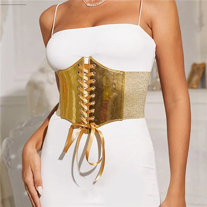 Gold lace up corset waist belt worn over a white dress